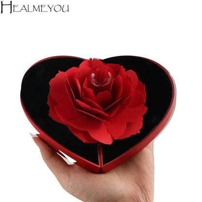 Caja de corazon con rosa 3D con un anillo de regalo